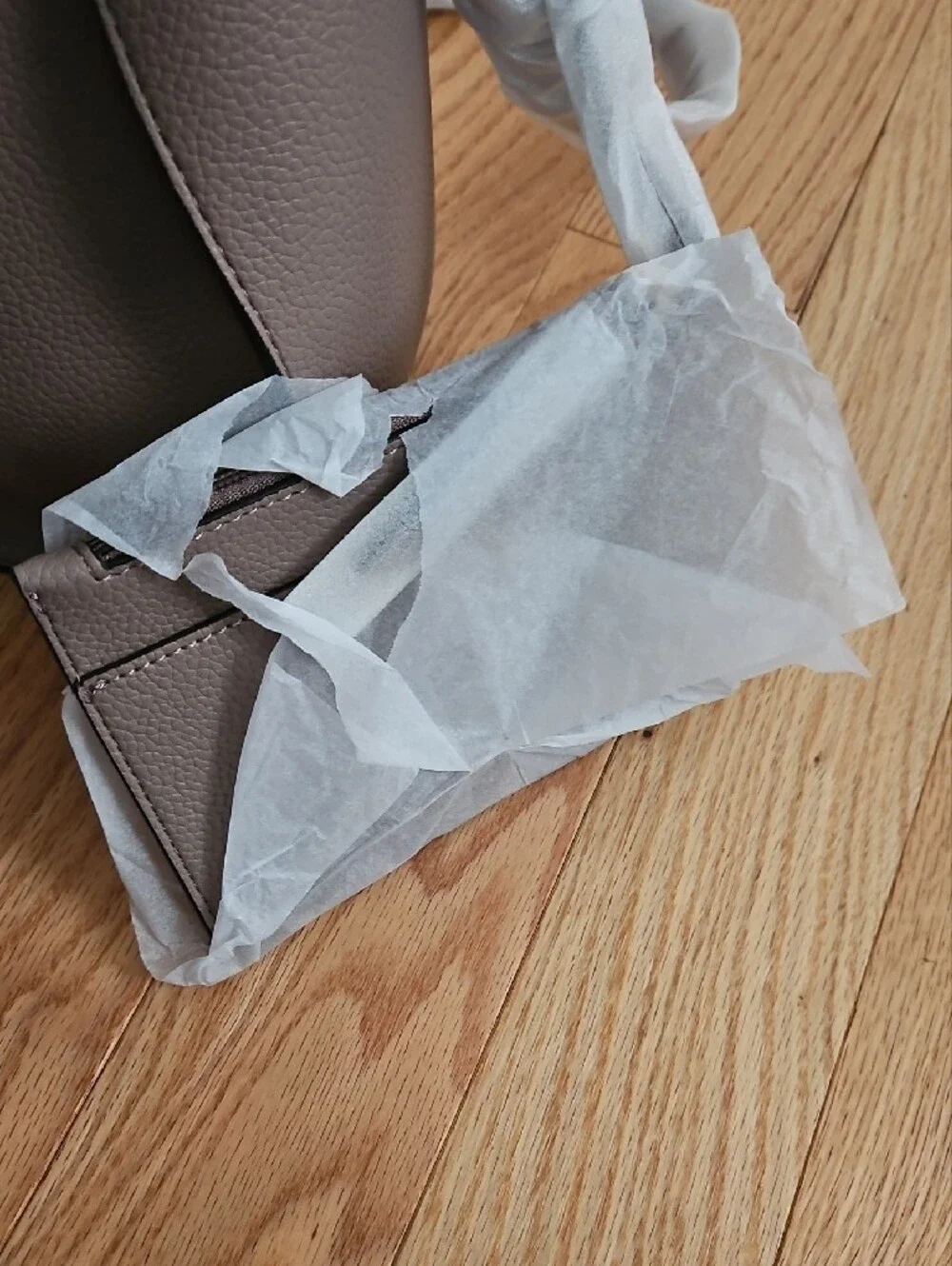 Calvin Klein small neutral tote with gold hardware. Includes a crossbody strap.
